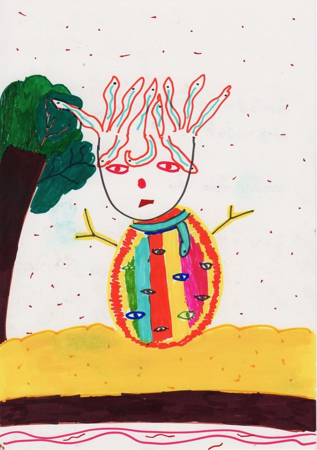 An alien with snake-like hair and a striped body covered in eyes, standing beside a tree.