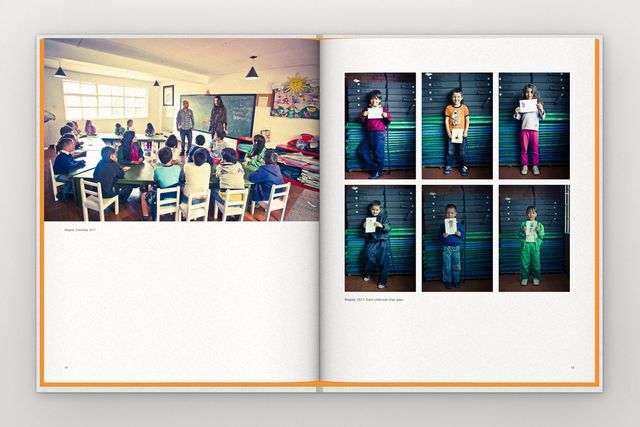 An open spread with photographs of the workshop in Bogotá, Colombia: a classroom, and six children holding up their drawings.
